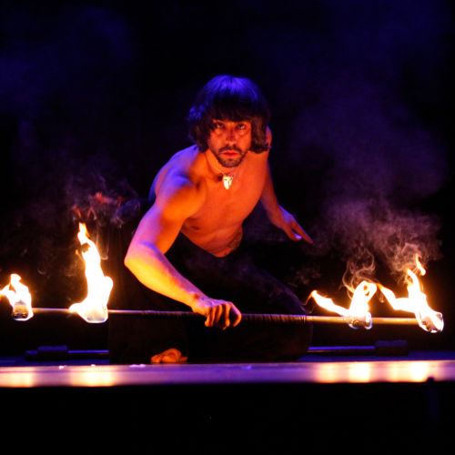 Into the fire: Miguel Rubio, nighttime shot, fire juggling in vivid colors