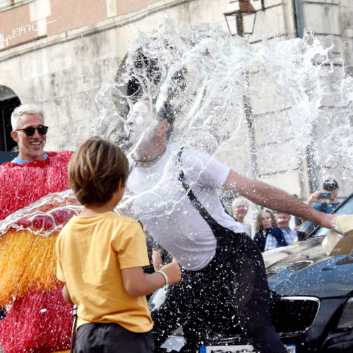 Clown Show and Improvisation Theater . clowning performance​. Agro the Clown receiving a bucket of water surrounded by the audience. Luca Della Gatta