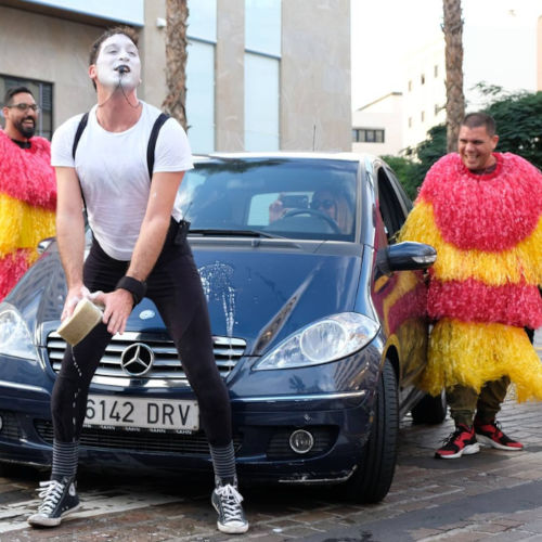 Unforgettable Street Mime Spectacle in Car Wash. Agro the Clown together with spectators dressed as car wash rollers. Luca Della Gatta