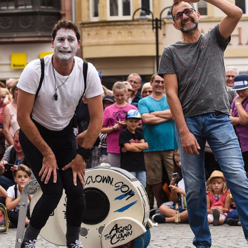 ImproLocura is a street mime show. Agro the clown next to a laughing spectator. Luca Della Gatta